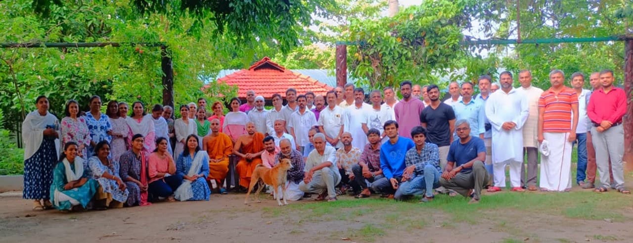 Monastic buildings and surrounding trees, conveying a quiet, working residence.